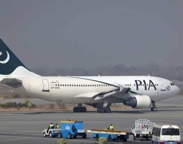 Pakistan international airlines passengers standing saudi arabia karachi madina flight