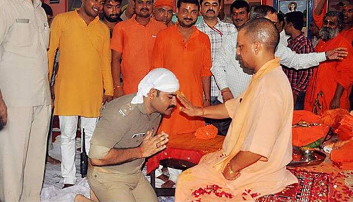 Policeman in uniform kneels before Adityanath to seek blessings, photos go viral