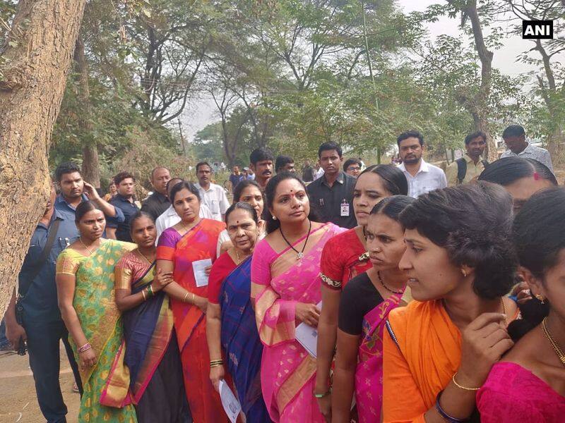 TRS MP Kavitha stands in a queue to cast her vote