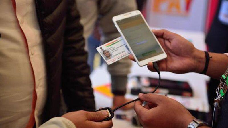 Aadhaar  voluntary for mobiles bank accounts Modi-headed Cabinet amendment