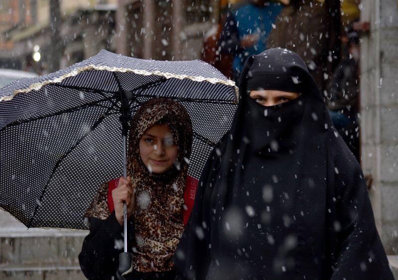 In pics: Heavy snowfall blankets Kashmir, disrupts normal life