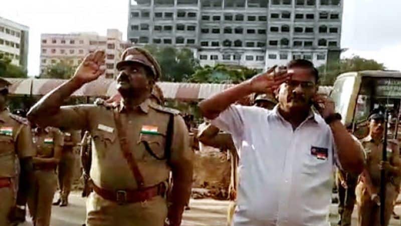 Railway officer using cellphone when flag