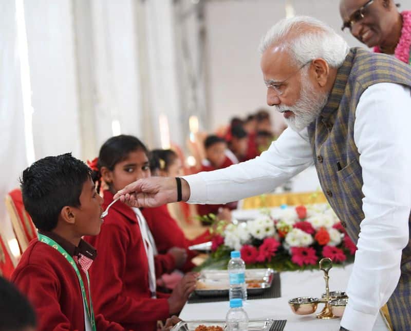 Prime Minister Narendra Modi serves three billionth Akshay Patra meal to poor school children in Vrindavan
