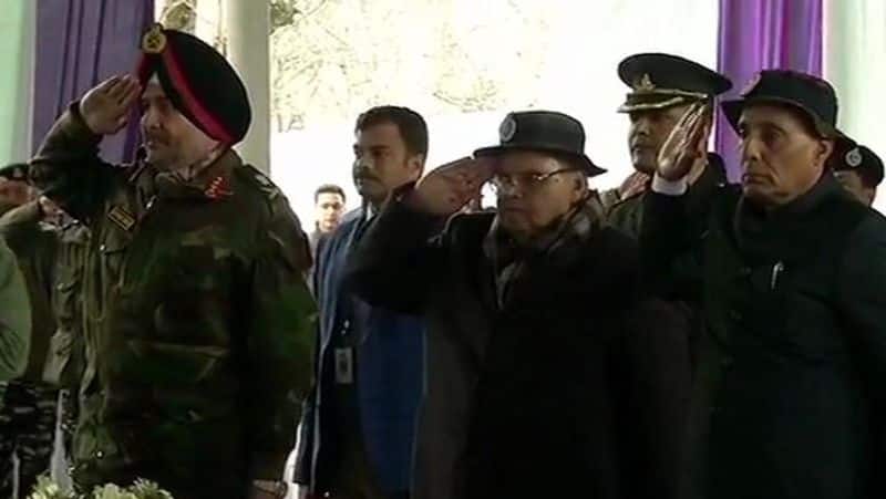 Union Ministers Rajnath Singh and J&K DGP Dilbagh Singh lend a shoulder to mortal remains of a CRPF soldier