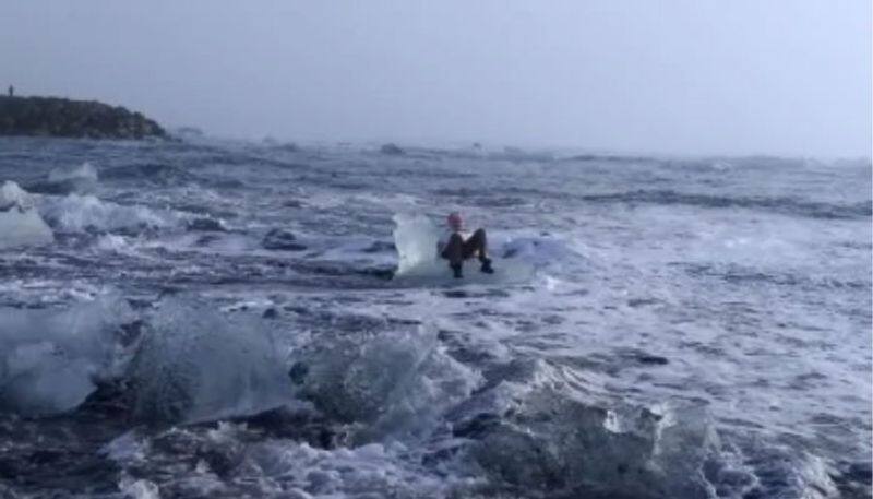 grandma climbed upon an iceberg to take photo and drifted out to sea