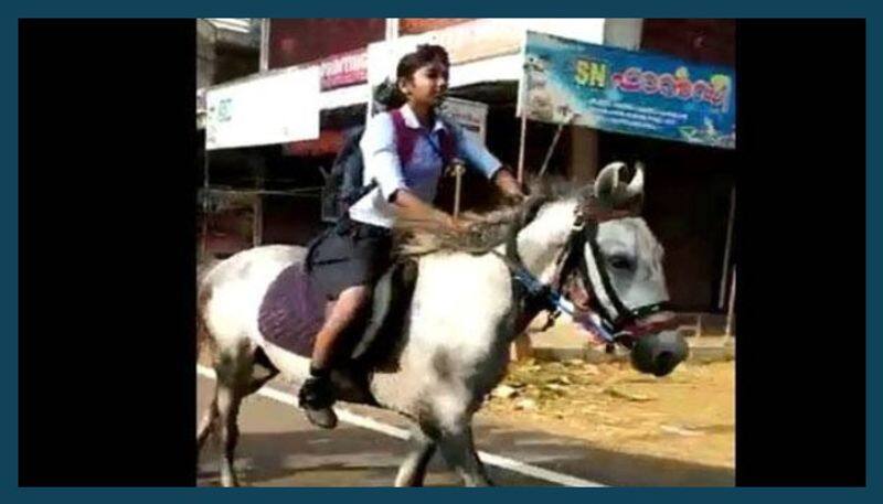 a girl krishna riding horse in kerala