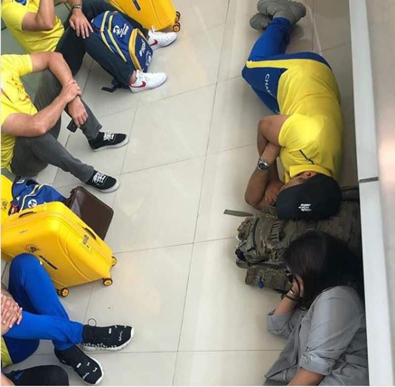 Dhoni  sleep on airport floor share picture on Instagram
