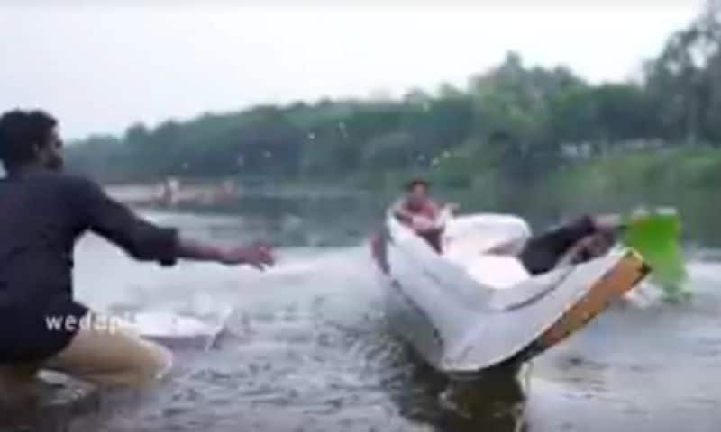 newly married couple fell down in pammam river water during photoshoot