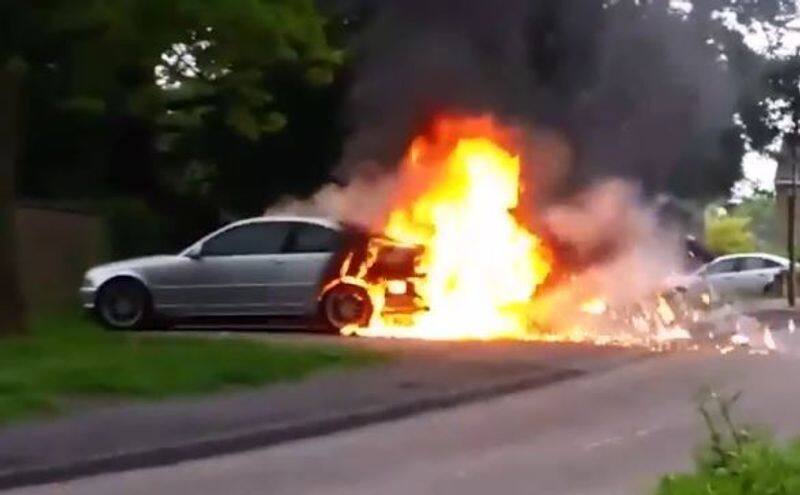 Owner Tries to Put Out Fire on BMW by Kicking, Blowing on the Flames