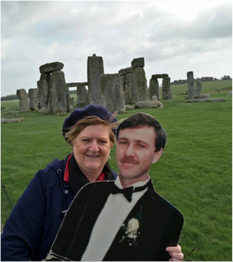 wife travels the world with cut-out of  husband who passed away