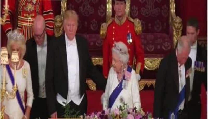 donald trump strikes controversy touches queen elizabeth and breaks protocol during england tour
