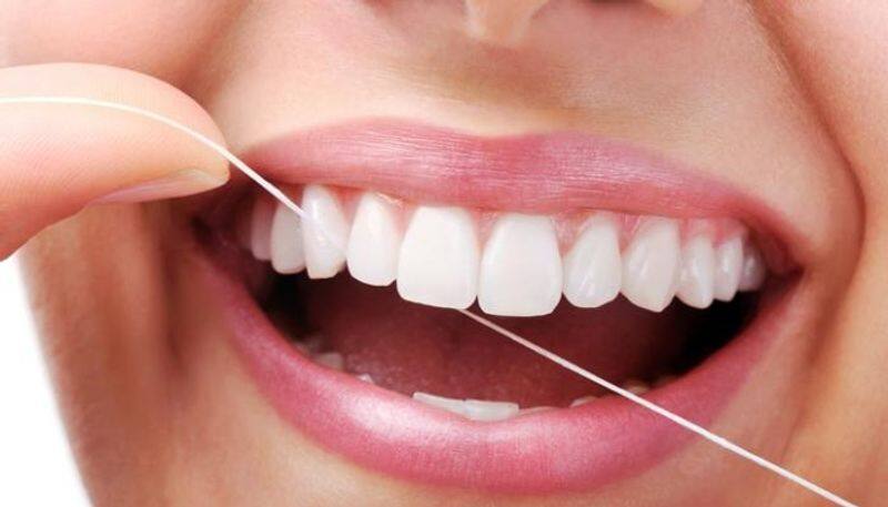 flossing to clean your teeth