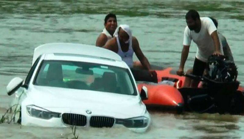 Haryana man pushes new bmw into river