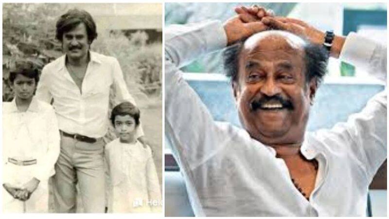 just find out who stands along with rajini in photograph?