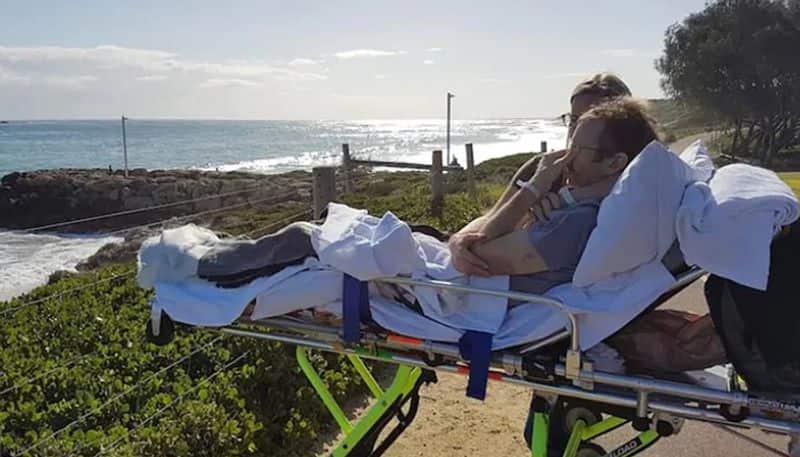 Father of four with terminal cancer breaks down as paramedics taking him home to die pull over so he can look at the sea for one last time