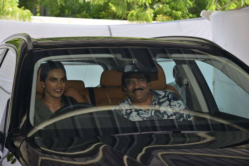 P V Sindhu presented with BMW X5 car by movie star Nagarjuna