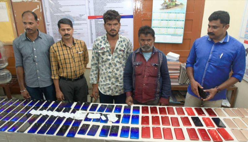 two held with duplicate phones of oppo and samsung