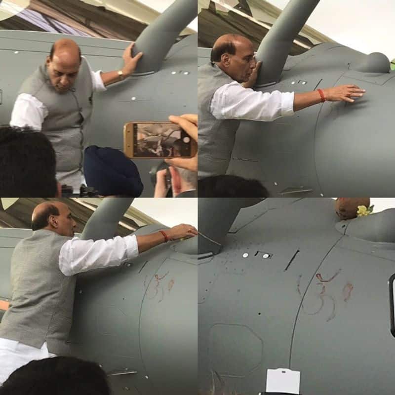 defence minister done Shastra Pooja  by writing ohm on Rafale