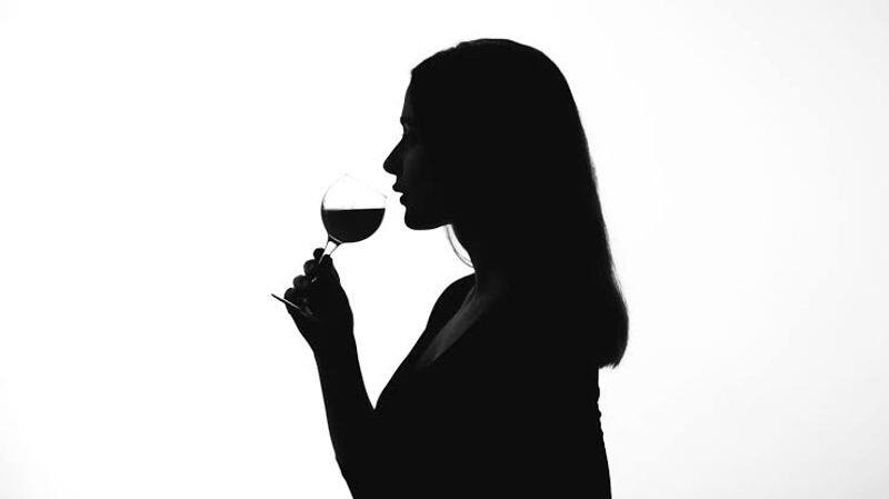 woman drink wine in public place