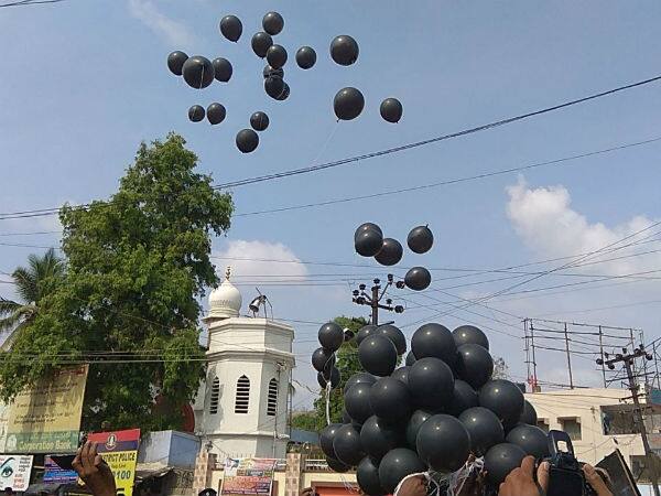 tamil protesters float black balloon against modi