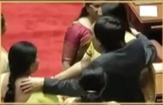 Male Congress leader hold woman MLCs hand forcibly Video TR Ramesh MLC Veena Achaiah women harassment