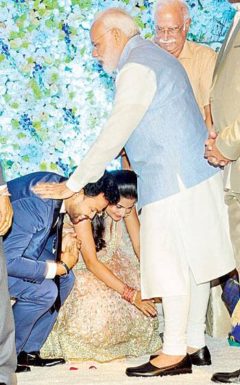 PM modi offering blessing to newly wed mp Rammohan Naidu