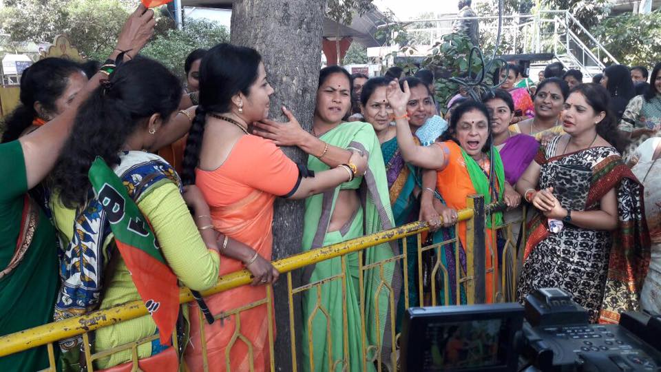 Women hug trees say no to steel bridge