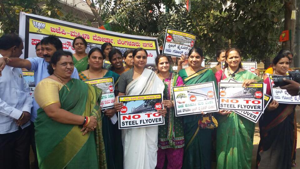 Women hug trees say no to steel bridge