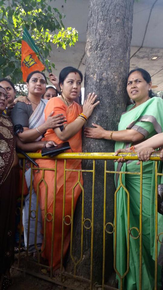Women hug trees say no to steel bridge