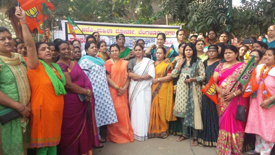Women hug trees say no to steel bridge