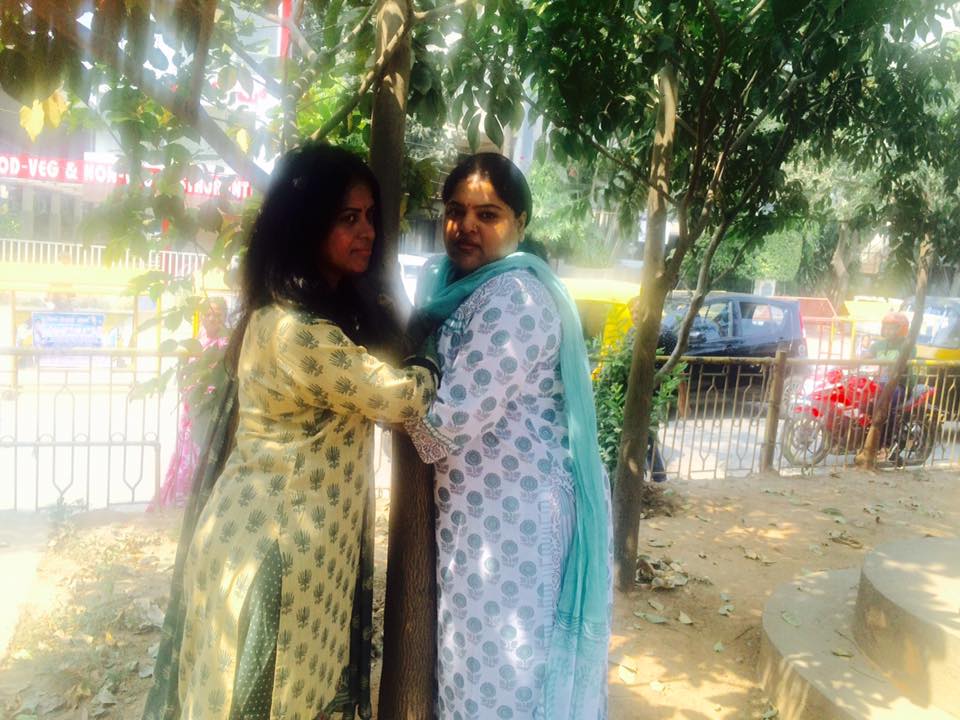 Women hug trees say no to steel bridge