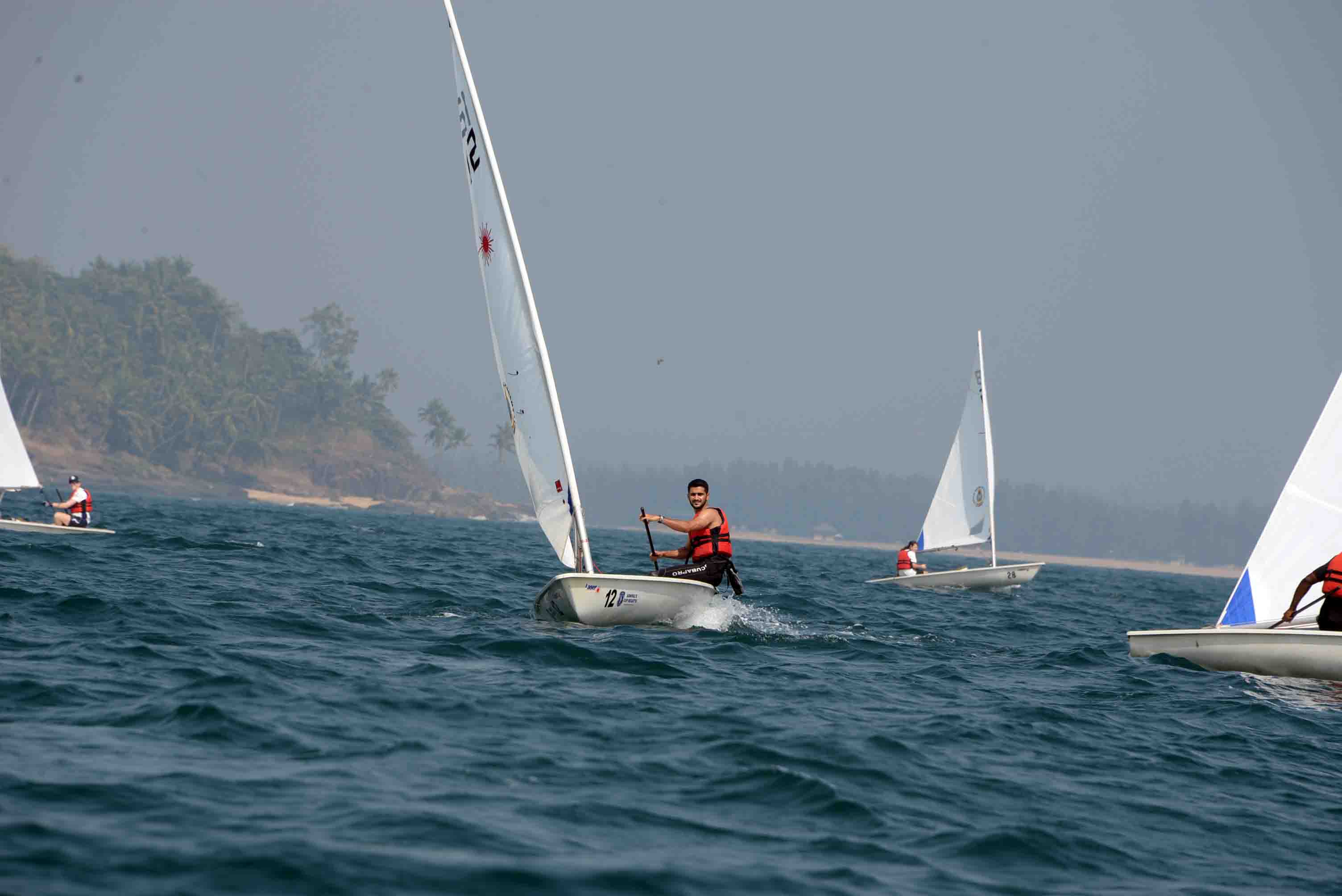 Sailors from across seas ride the waves off scenic Kerala beach