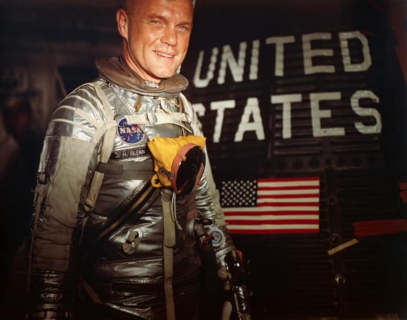 John Glenn first man to orbit earth three times Neil Armstrong