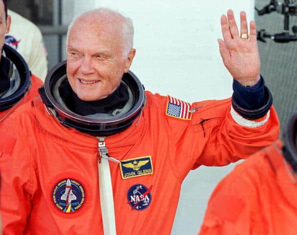 John Glenn first man to orbit earth three times Neil Armstrong