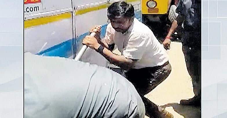 Kerala rescue team IAS officer raja manickam take rice bags