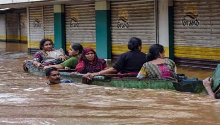 Kerala floods people stranded await rescue roads damaged