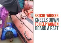 Kerala floods  rescue worker help women raft viral