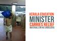 Kerala floods State Education Minister C Raveendranath relief materials shoulders Video