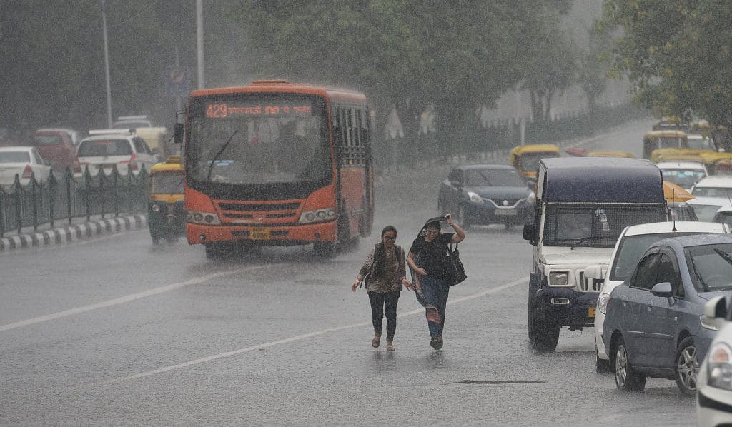 Delhi rain traffic jam NCR DND Flyover Indira Gandhi International airport