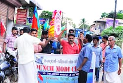 Kerala police AIYF AISF activists Yuva Morcha punch Modi challenge