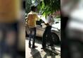Delhi police traffic cop fine wrongly parked vehicle verbal abuse break phone