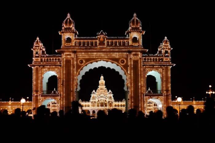 Mysore Palace is the second most famous tourist attraction in India.  The three-storied stone palace is one of seven historical palaces in Mysore, with very beautiful dark pink marble domes.
