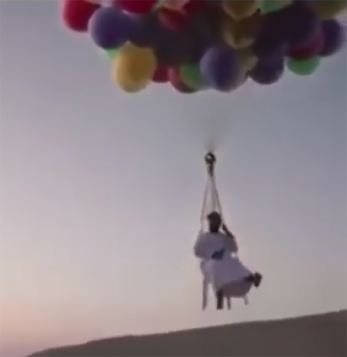 arab man fly from uae to oman using helium balloon