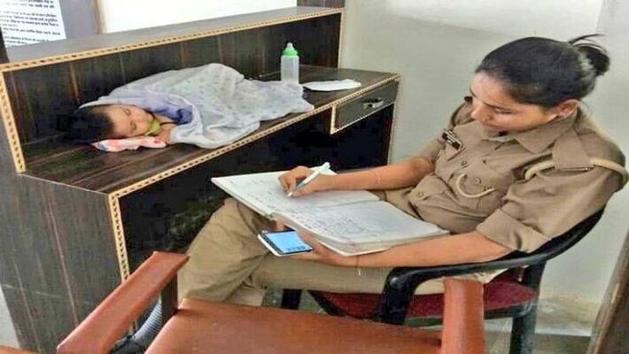Police Mom Guarding Baby At Work in Uttar Pradesh Police Mom Guarding Baby At Work in Uttar Pradesh