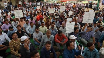 Delhi Transport Corporation strike better pay union workers protest minimum wage