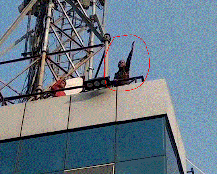 Women policemen climbed a tall building after getting no salary