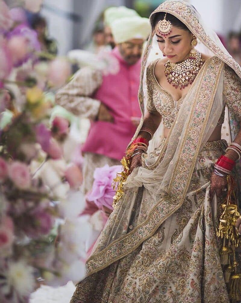Her bridal lehenga was made using one hundred and eleven colours of silk thread and sequins weaved into artistic panels translated from Persian works, a signature Sabyasachi design. The actor tied the knot with restaurateur Imrun Sethi.