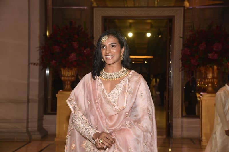 Badminton star and Olympian PV Sindhu arrives for the reception of Deepika and Ranveer. She is seen in a pink outfit.