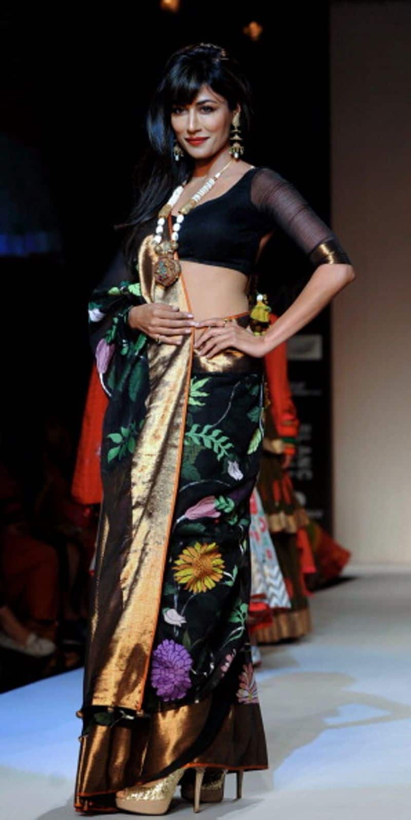 Take a cue from this Gaurang sari to opt for a sheer sleeved blouse with embellished border to switch things up.