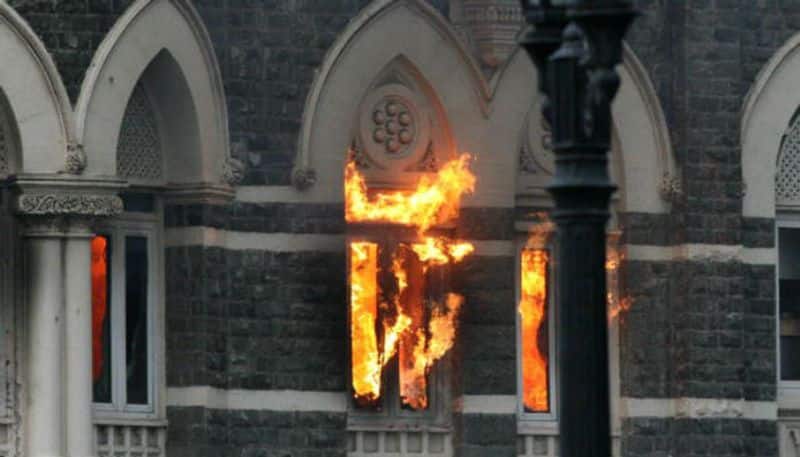 A fire burns at Taj Mahal Palace & Tower Hotel following the armed siege.